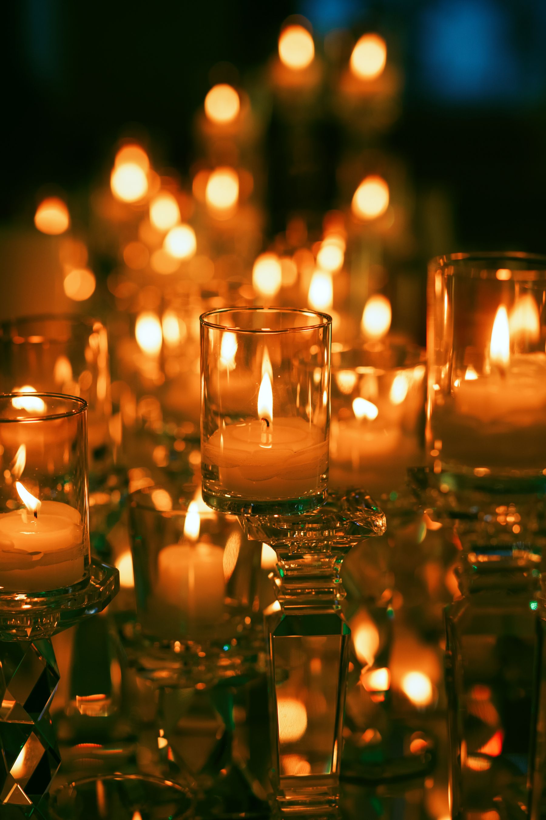 Candles glowing on restaurant tables